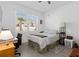 Bright bedroom with a large window, ample natural light, and neutral decor at 1129 Blue Garden Dr, Deland, FL 32720
