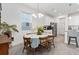 Well-lit dining area with a view of the kitchen, perfect for Gathering meals and entertaining at 1129 Blue Garden Dr, Deland, FL 32720