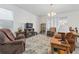 Cozy living room featuring comfortable seating, natural light, and neutral tones at 1129 Blue Garden Dr, Deland, FL 32720