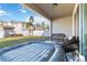 Covered patio featuring outdoor seating and a hot tub overlooking the grassy backyard at 1129 Blue Garden Dr, Deland, FL 32720