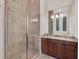 Bathroom features a frameless glass shower and granite vanity at 11306 Bridge House Rd, Windermere, FL 34786