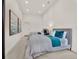 Bedroom with two beds, carpeted floor, neutral colors and large artwork at 11306 Bridge House Rd, Windermere, FL 34786