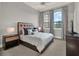 Comfortable bedroom showcasing two windows, carpeted floors and neutral decor at 11306 Bridge House Rd, Windermere, FL 34786