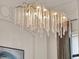 Unique chandelier adds a touch of elegance and modern style to the dining space at 11306 Bridge House Rd, Windermere, FL 34786