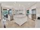 Spacious open-plan kitchen with large center island, premium appliances, and tiled floors at 11306 Bridge House Rd, Windermere, FL 34786
