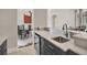Modern kitchen with marble countertops, stainless steel appliances, and open access to the dining area at 11306 Bridge House Rd, Windermere, FL 34786