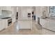 Gourmet kitchen features an island, stainless steel appliances, and custom cabinetry at 11306 Bridge House Rd, Windermere, FL 34786
