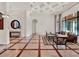 Bright living area with coffered ceiling, large windows, and stylish furniture in a luxurious residence at 11306 Bridge House Rd, Windermere, FL 34786