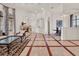 Spacious living room with fireplace, decorative ceilings, and open layout to dining area in luxurious home at 11306 Bridge House Rd, Windermere, FL 34786