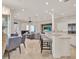 Open-concept living space includes a dining area, bar seating, and cozy lounge perfect for gatherings at 11306 Bridge House Rd, Windermere, FL 34786