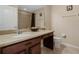 Bathroom featuring a vanity with drawers and a large mirror, along with a shower and toilet at 12189 Beach Fern Rd, Orlando, FL 32824