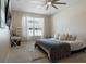 Relaxing bedroom showcasing neutral tones, natural light, and stylish decor elements at 12189 Beach Fern Rd, Orlando, FL 32824