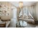 Formal living room boasting a decorative chandelier and ample seating for guests at 12189 Beach Fern Rd, Orlando, FL 32824