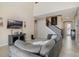 Open-concept living room featuring a staircase, media console, and comfortable seating at 12189 Beach Fern Rd, Orlando, FL 32824