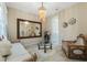 Elegant living room with luxurious accents, a glass coffee table, and neutral decor at 12189 Beach Fern Rd, Orlando, FL 32824