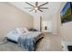Spacious bedroom with a neutral palette, plush carpet, and ensuite bathroom at 12189 Beach Fern Rd, Orlando, FL 32824