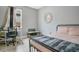 Bedroom featuring metal bed frame, desk, chair and large mirror at 13227 Spring Grove Way, Winter Garden, FL 34787