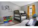 Comfortable bedroom featuring a wooden bunk bed, storage and a desk at 13227 Spring Grove Way, Winter Garden, FL 34787