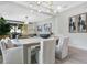 Elegant dining room with modern chandelier, seating for six, and backyard views at 13227 Spring Grove Way, Winter Garden, FL 34787