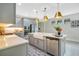 Well-lit kitchen featuring a farmhouse sink, stainless steel appliances, and ample counter space at 13227 Spring Grove Way, Winter Garden, FL 34787