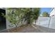 Paver courtyard features landscaping, privacy fence and side door access at 15471 Honeybell Dr, Winter Garden, FL 34787