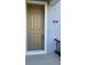 Attractive front door with digital lock and modern hardware at 15471 Honeybell Dr, Winter Garden, FL 34787
