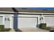 Spacious two-car garage with attached address numbers at 15471 Honeybell Dr, Winter Garden, FL 34787