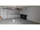 Spacious two car garage with epoxy floor and newer garage door at 15471 Honeybell Dr, Winter Garden, FL 34787