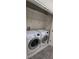 Neat laundry room featuring a newer washer and dryer set at 15471 Honeybell Dr, Winter Garden, FL 34787