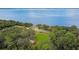 Scenic aerial view of a waterfront property surrounded by lush greenery and the vastness of the lake at 170 Palmetto Woods Ct # 3A, Deltona, FL 32725