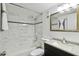 Updated bathroom with marble tile in shower, modern vanity and fixtures offering a clean and bright space at 170 Palmetto Woods Ct # 3A, Deltona, FL 32725