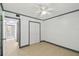 Cozy bedroom with double door closet, ceiling fan, and nearby bathroom, ideal for relaxing at 170 Palmetto Woods Ct # 3A, Deltona, FL 32725