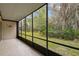 Relaxing screened-in patio with a peaceful backyard view at 170 Palmetto Woods Ct # 3A, Deltona, FL 32725