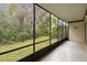 Scenic view from screened patio, overlooking lush greenery and trees at 170 Palmetto Woods Ct # 3A, Deltona, FL 32725