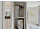 Utility closet featuring a water heater, storage, and ventilation at 170 Palmetto Woods Ct # 3A, Deltona, FL 32725