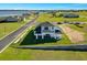 Aerial view of a home featuring a well-manicured lawn and picturesque neighborhood at 200 Snowy Orchid Way, Lake Alfred, FL 33850