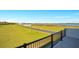 Scenic view of expansive backyard and lake from the property's outdoor space at 200 Snowy Orchid Way, Lake Alfred, FL 33850