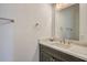 Half bath features a quartz countertop and modern towel rack at 200 Snowy Orchid Way, Lake Alfred, FL 33850