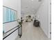 Spacious hallway leading to an open living area, adorned with stylish decor and neutral tones at 200 Snowy Orchid Way, Lake Alfred, FL 33850