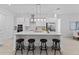 Well-designed kitchen with a large island, modern appliances, and ample cabinet space at 200 Snowy Orchid Way, Lake Alfred, FL 33850