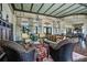 Spacious lounge area with plush seating, elegant chandeliers, high ceilings, and views of the outdoors at 200 Snowy Orchid Way, Lake Alfred, FL 33850