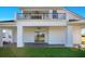 Spacious outdoor patio for entertaining, featuring access to a grassy backyard at 200 Snowy Orchid Way, Lake Alfred, FL 33850