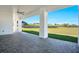 Spacious outdoor patio with stone pavers and views of the expansive backyard at 200 Snowy Orchid Way, Lake Alfred, FL 33850
