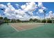 Well-maintained community tennis courts with lush landscaping provide an active lifestyle in a beautiful setting at 200 Snowy Orchid Way, Lake Alfred, FL 33850