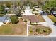 Overhead view of the property showcasing the home, roof, driveway and surrounding landscape at 2101 Lake Francis Dr, Apopka, FL 32712