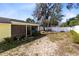 Well-kept backyard with a screened-in porch and lush greenery, providing a serene outdoor space at 2101 Lake Francis Dr, Apopka, FL 32712