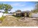 Spacious backyard featuring a screened lanai and fire pit, perfect for outdoor entertaining at 2101 Lake Francis Dr, Apopka, FL 32712