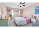 Bedroom with bright, natural light, pastel colored walls and a ceiling fan at 2101 Lake Francis Dr, Apopka, FL 32712