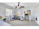 Bedroom with bright, natural light, a ceiling fan, and space for a desk at 2101 Lake Francis Dr, Apopka, FL 32712