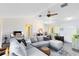 Open living room with vaulted ceiling, ceiling fan, hardwood floors, and natural light at 2101 Lake Francis Dr, Apopka, FL 32712
